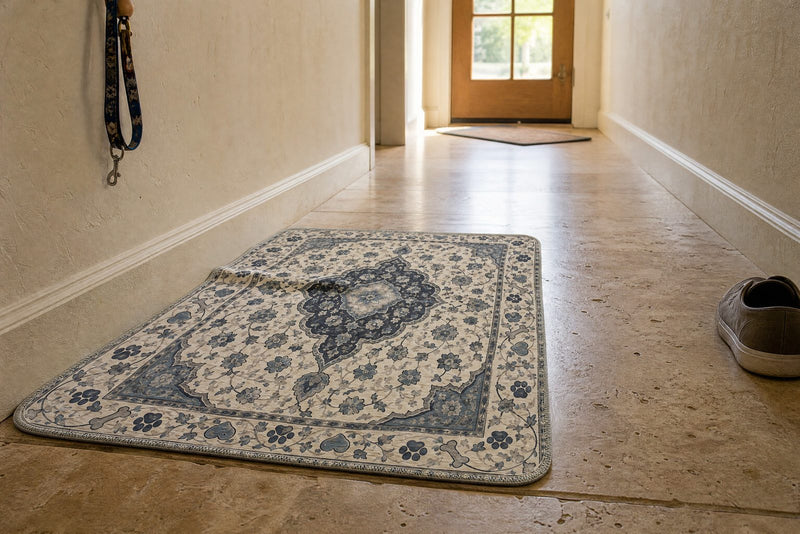 A hallway with a pee pad partway along it and a 