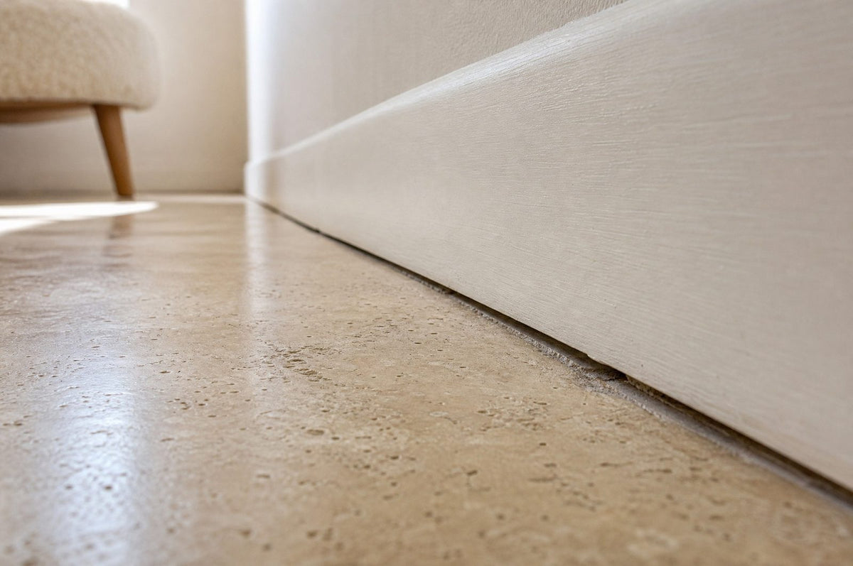 Floor-level view along a skirting board where 