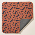 Brown Bones washable pee pad, one corner turned back to show the silicone-dot underside