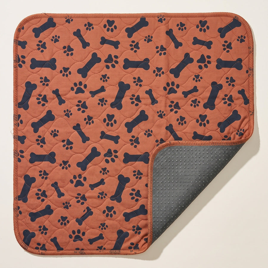 Brown Bones washable pee pad, one corner turned back to show the silicone-dot underside