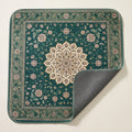 Forest Medallion washable pee pad, deep green with a floral medallion, one corner turned to show the grey underside