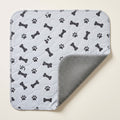 Grey Bones washable pee pad, one corner turned back to show the silicone-dot underside