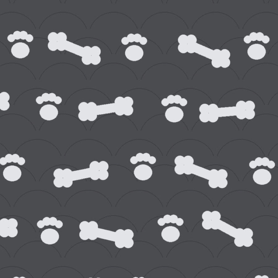 Charcoal grey print with pale dog bones and paw prints over faint arches, used on the washable pee pad