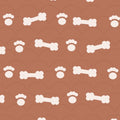 Clay brown print with cream dog bones and paw prints over faint arches, used on the washable pee pad
