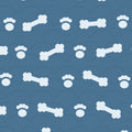 Ocean blue print with pale dog bones and paw prints over faint arches, used on the washable pee pad