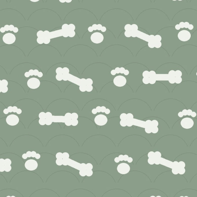 Sage green print with white dog bones and paw prints over faint arches, used on the washable pee pad